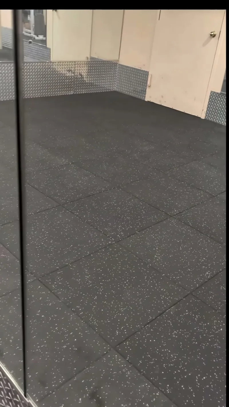 A spotless commercial studio floor and mirrors.
