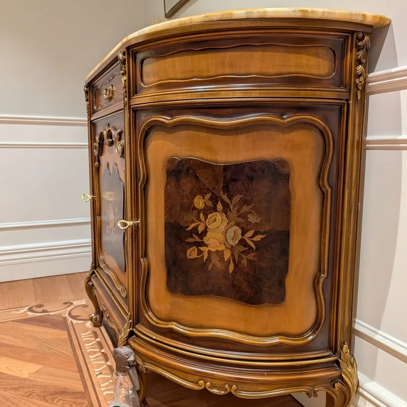 Fine furniture care on an ornate wooden credenza.